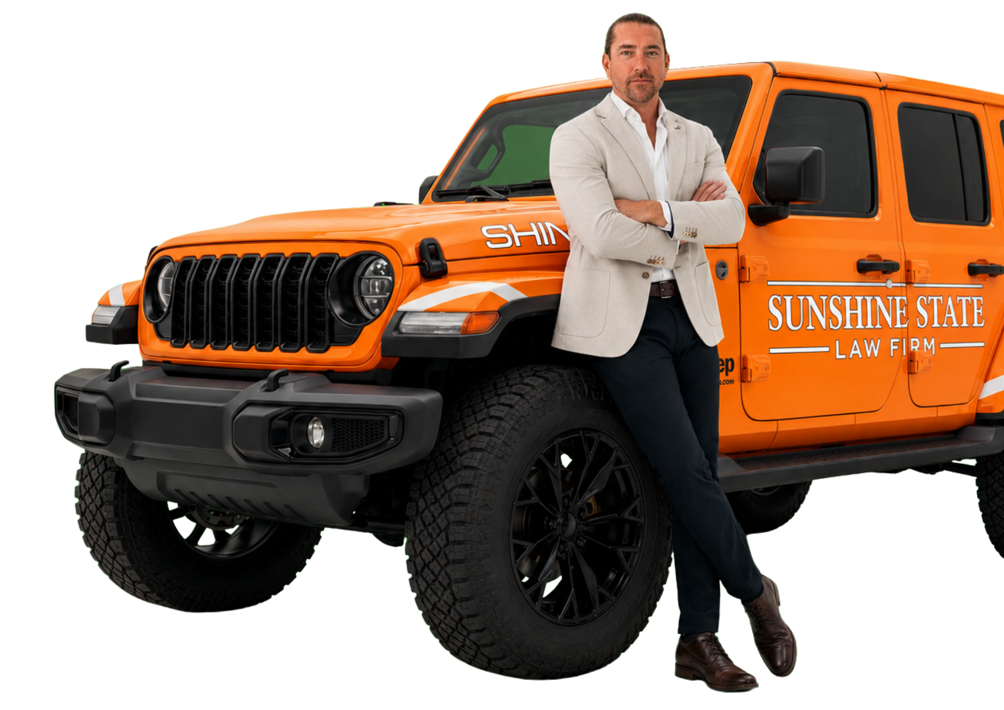 Simon Nicholson leaning on the orange Sunshine State Law Firm Jeep