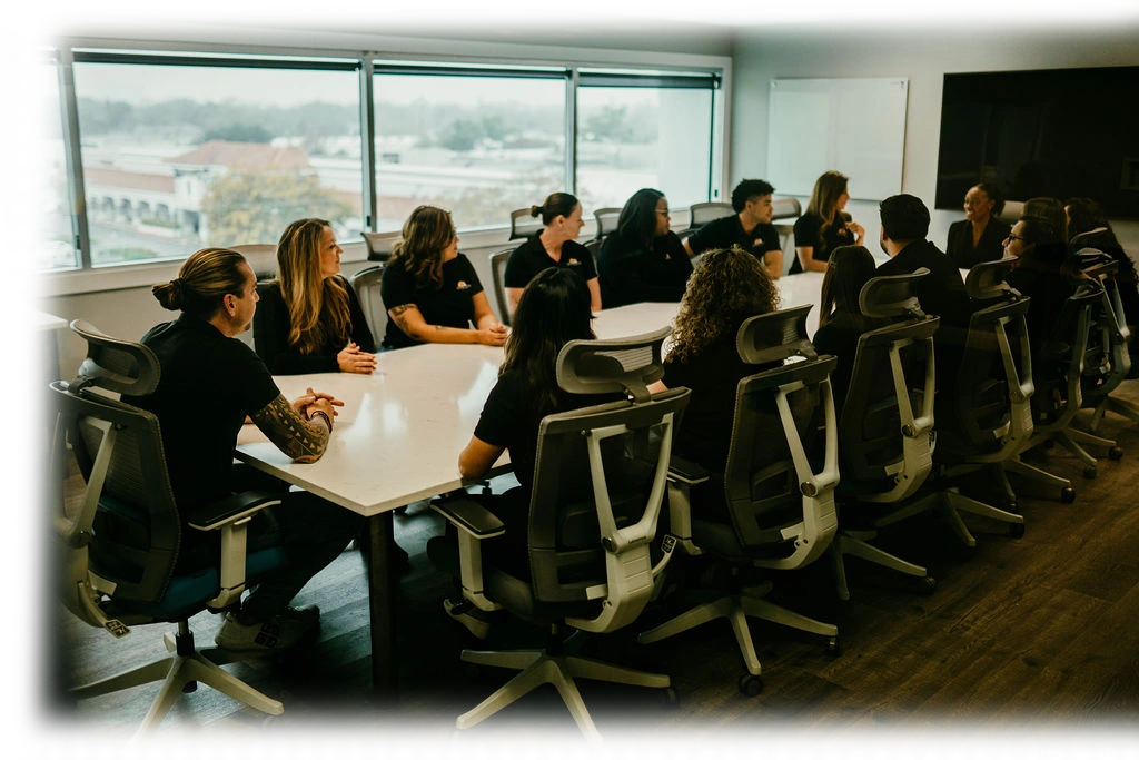 The Sunshine State Law Firm team meeting around a conference table